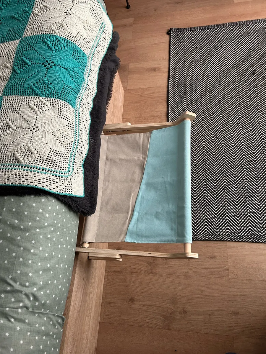 Wooden sill perch in use, photo sent in by Pauline Z.
